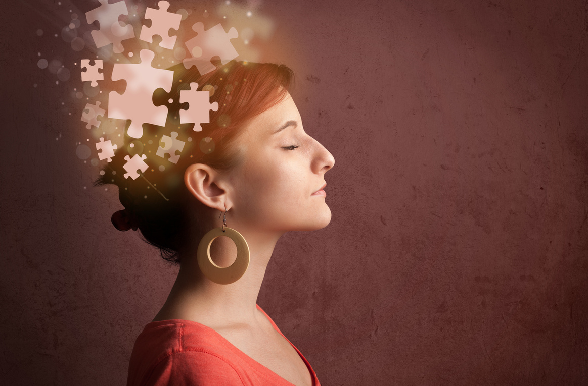 Young person thinking with glowing puzzle mind